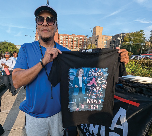 DNC merch vendor holding tee