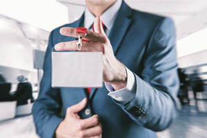 man holding tradeshow lanyard