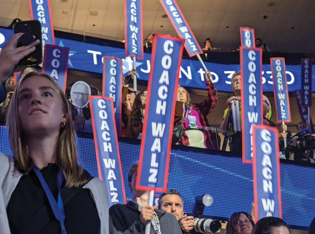 DNC goers waving signs